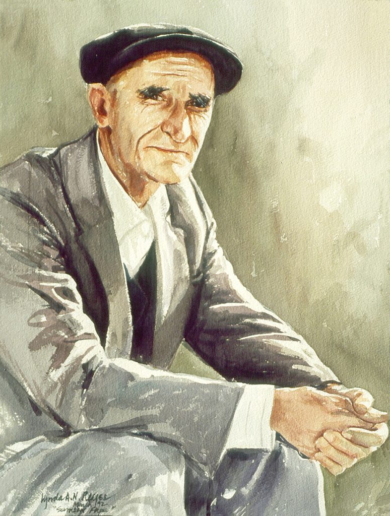 seated man looking at viewer